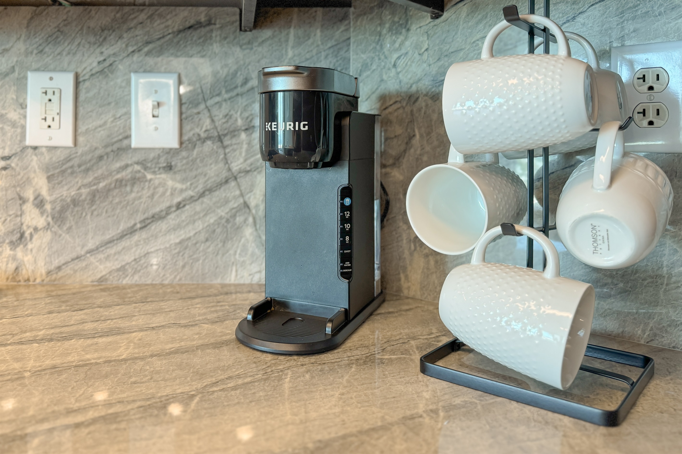 Start your day right with this well-equipped kitchen countertop. Featuring a Keurig coffee maker - your morning routine just got easier.