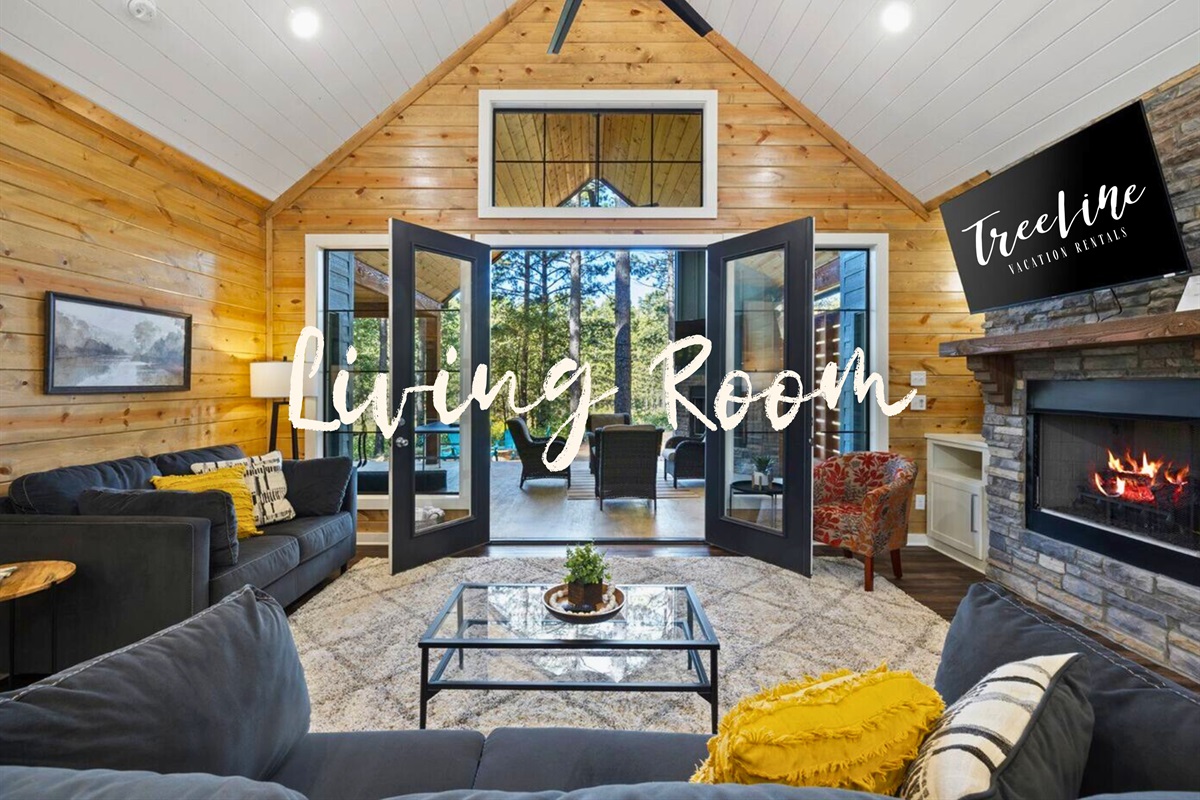 Gather around the warmth of the fire in a living room that's both spacious and intimate.