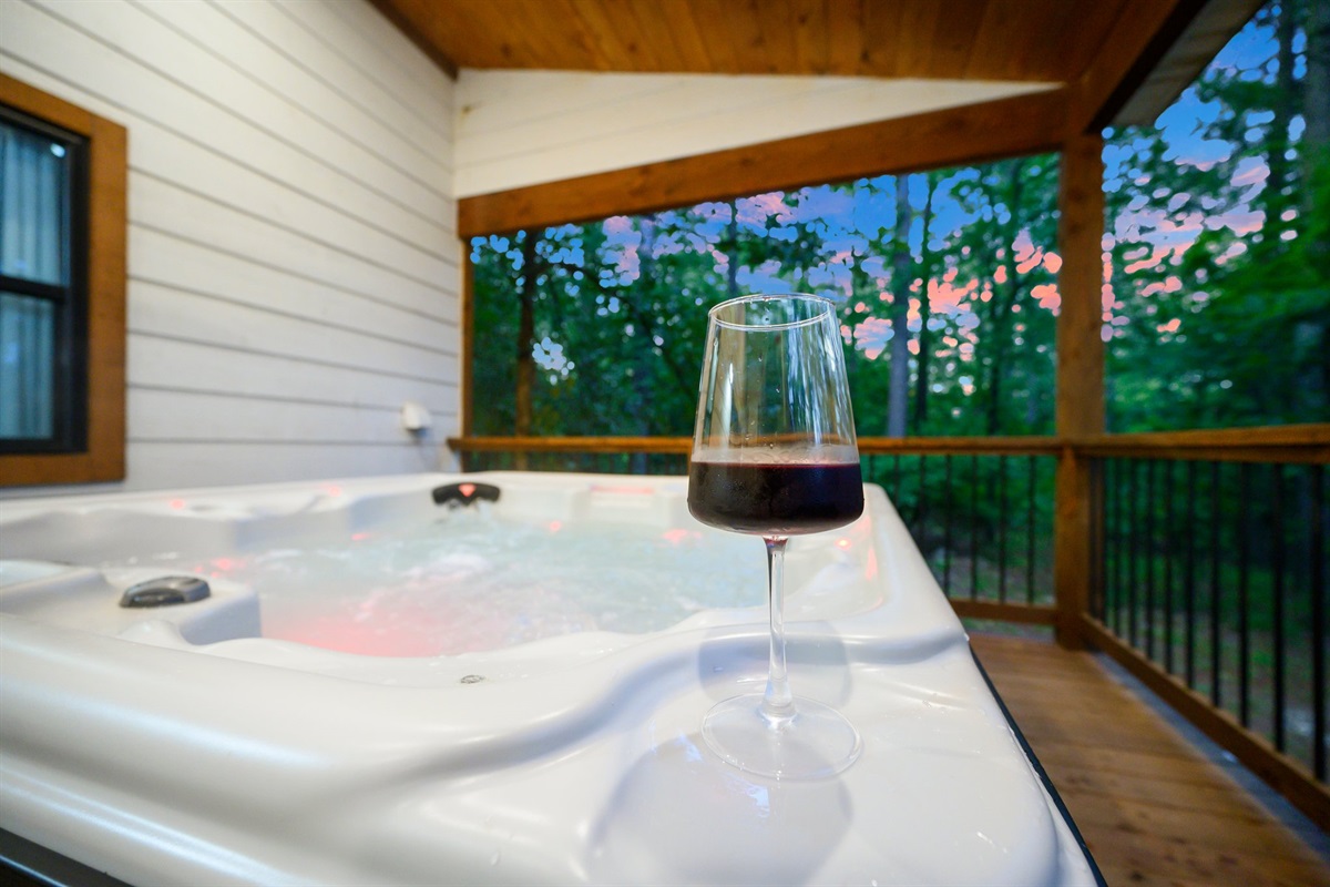 Hot Tub Retreat: Unwind in the bubbly warmth with a sunset view and a glass of wine!