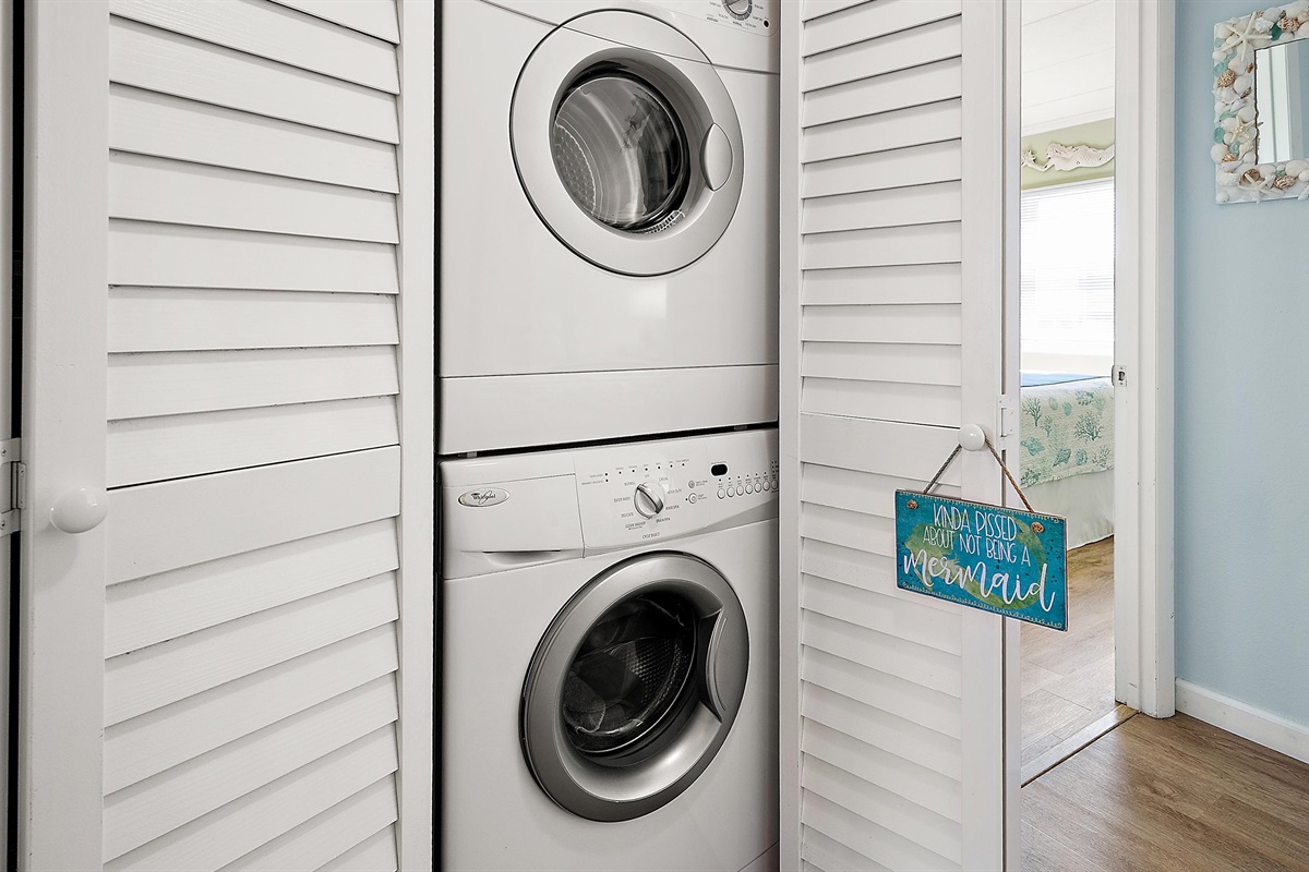 Washer and dryer located in the hallway for easy access.