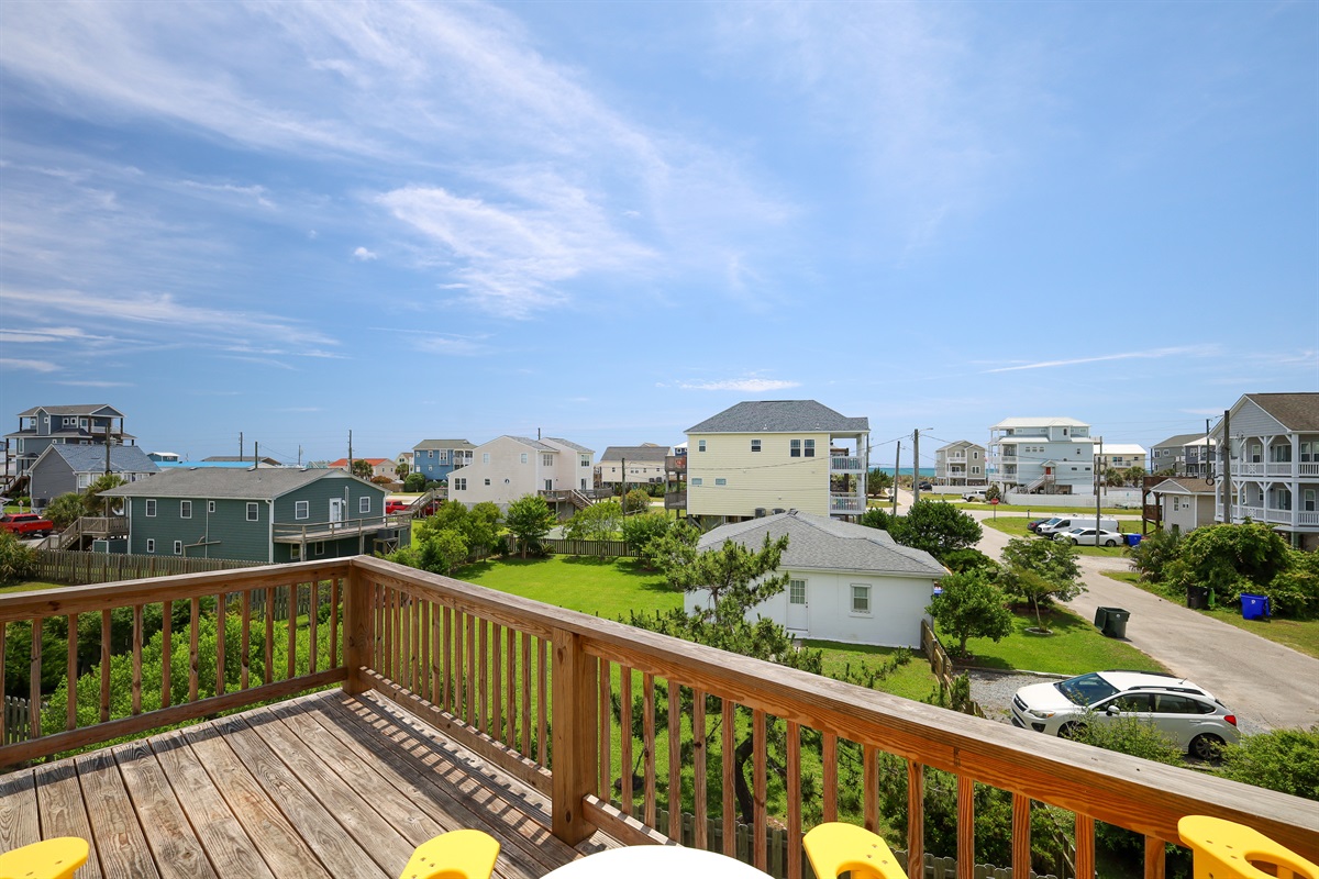 Wooden deck overlooking the neighborhood on a clear day