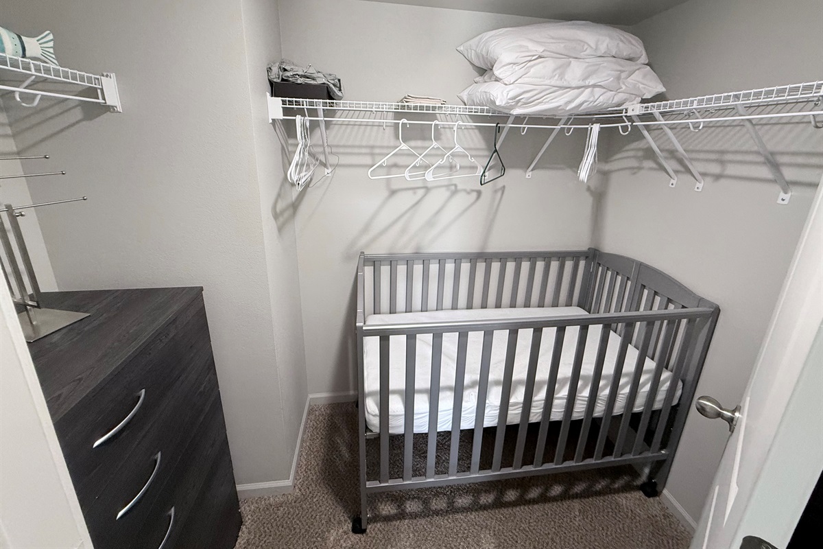 crib is stored in closet. can be rolled into bedroom