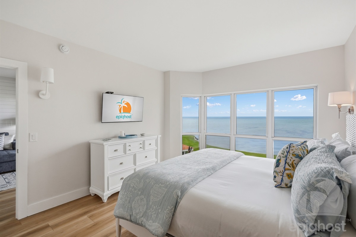 Master bedroom with king bed and bay views