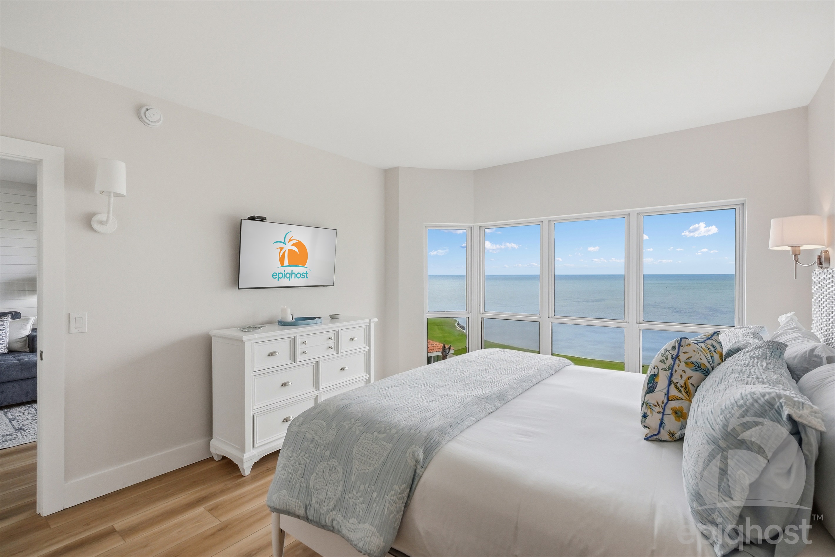 Master bedroom with king bed and bay views