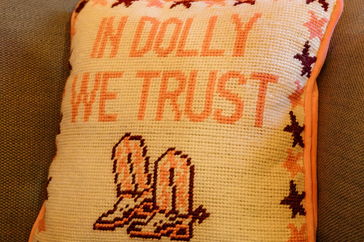 Charming western details like needlepoint pillows add character throughout Poppywood Pines. This gothic western Show Low A-frame features authentic touches that celebrate Arizona's heritage, creating a unique White Mountains vacation rental with personalit