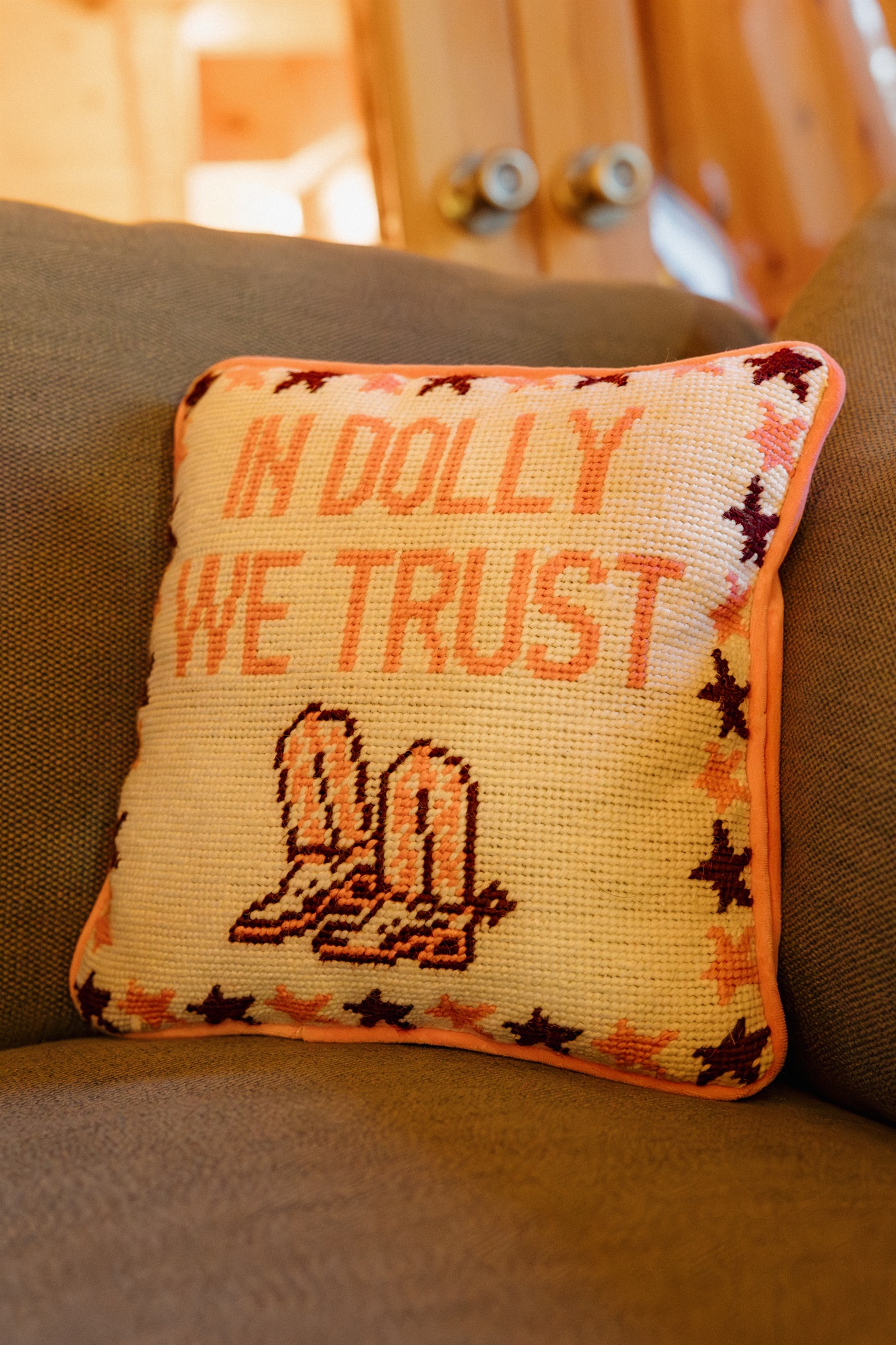 Charming western details like needlepoint pillows add character throughout Poppywood Pines. This gothic western Show Low A-frame features authentic touches that celebrate Arizona's heritage, creating a unique White Mountains vacation rental with personalit