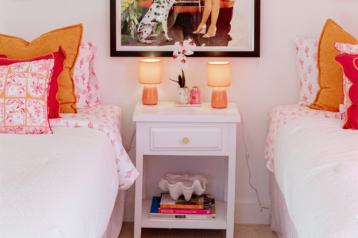 The third bedroom has themes of Palm Beach in pink and red, a stylish and fun way to be immersed in the local culture.