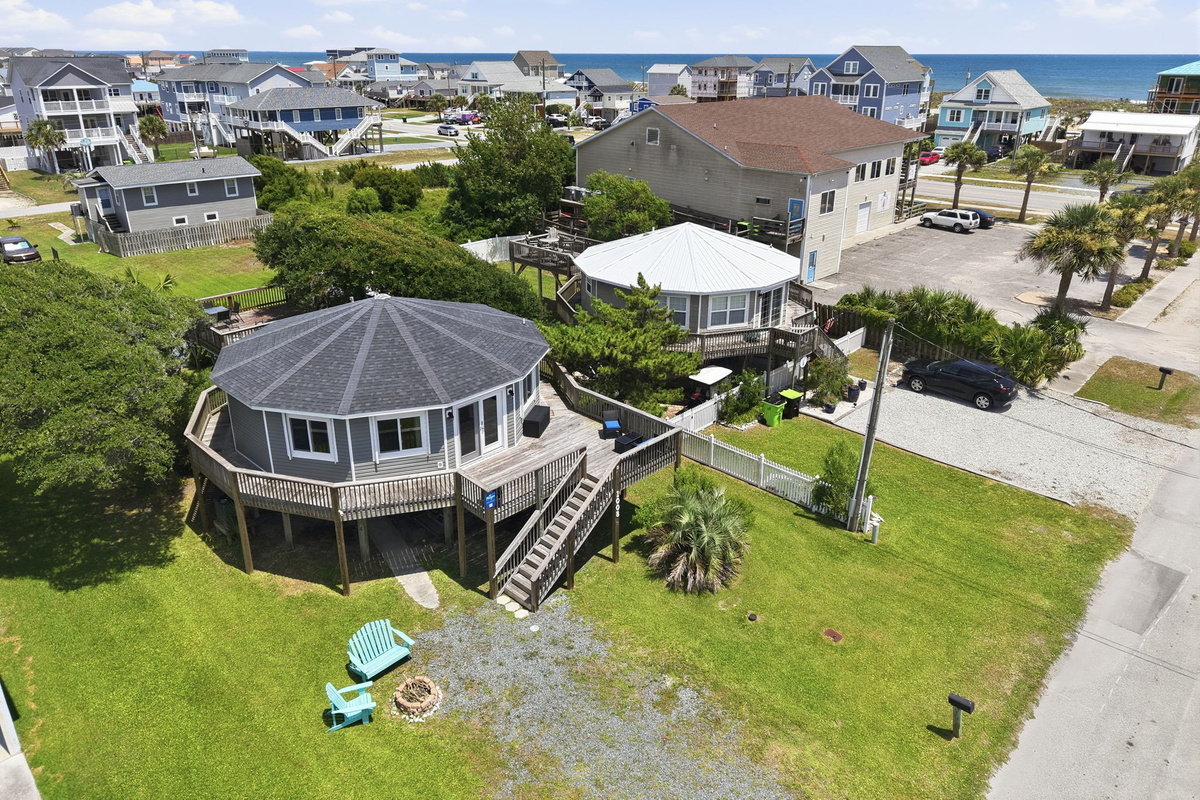 Aerial view showcasing the home's prime location just a short walk from the beach