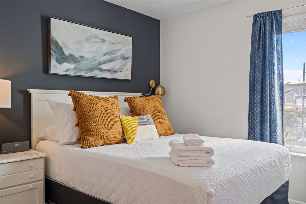 Cozy coastal bedroom with full amenities