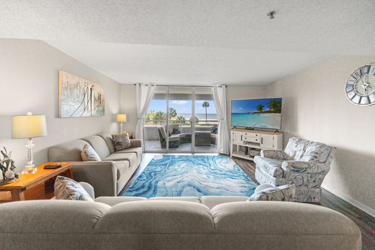 Oceanfront Living Room area with sleeper sofa, TV and balcony access