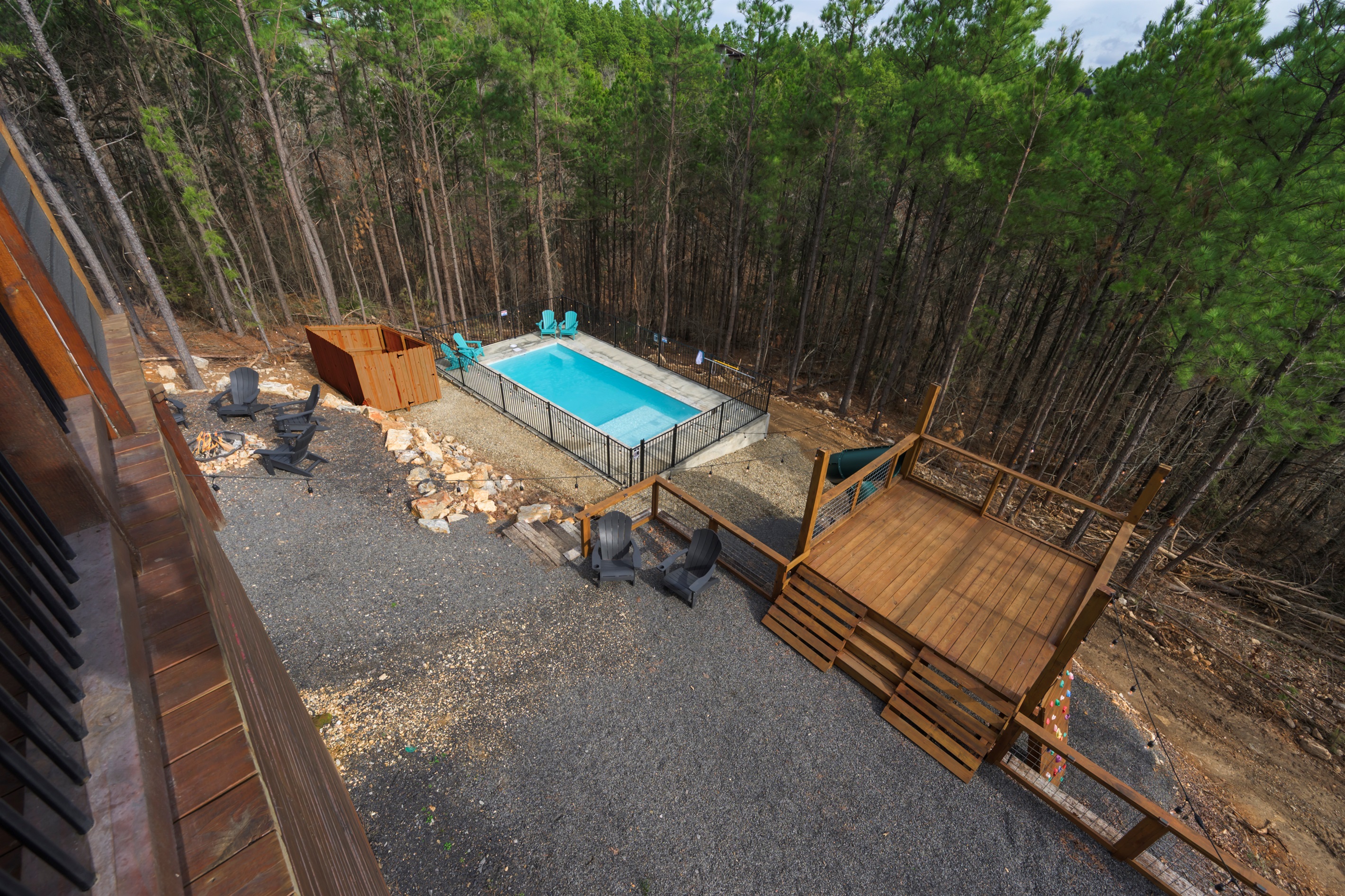 Multiple levels of outdoor living—pool, fire pit, and elevated deck views