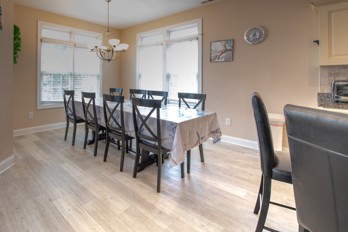 Dining Table with Seating for Eight Adjacent to Kitchen
