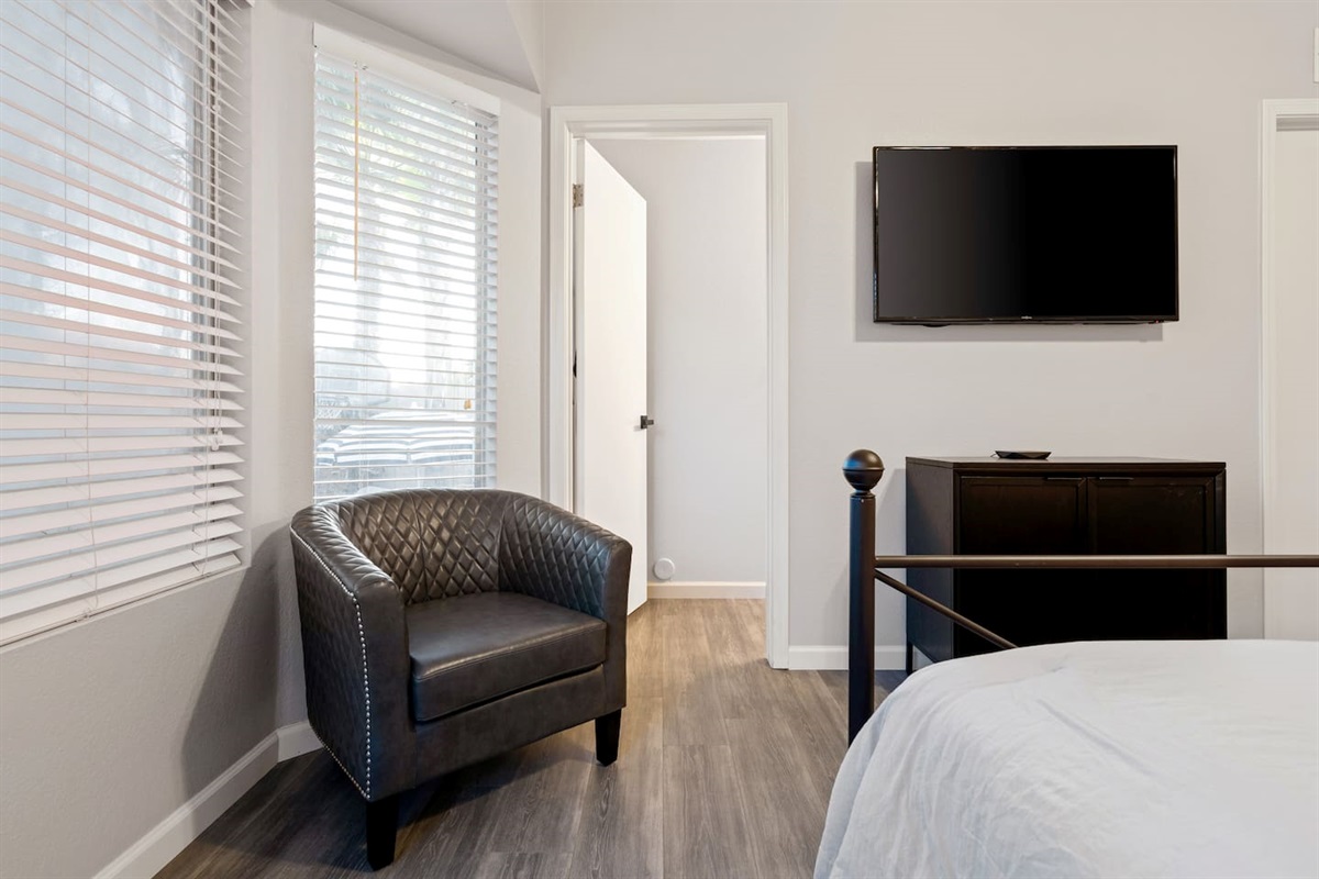 There's plenty of space in the main bedroom, including a sitting area and TV
