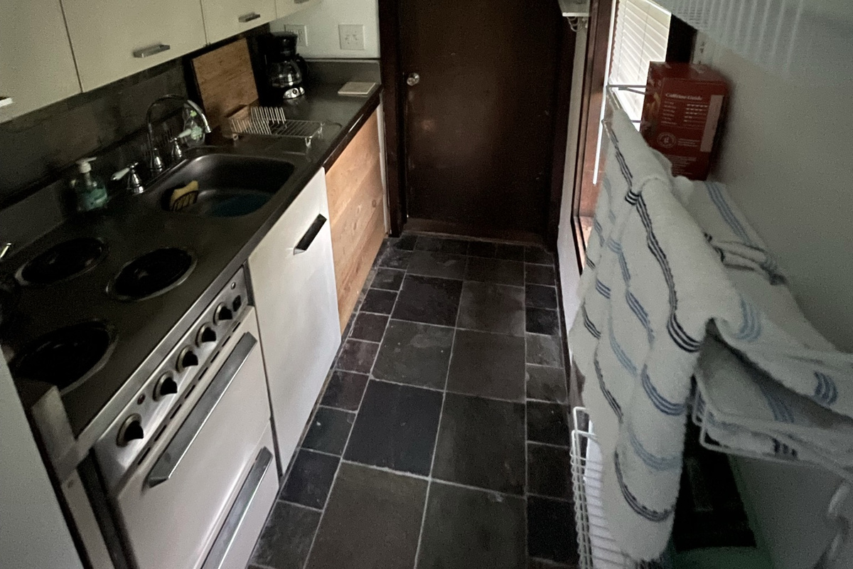 Kitchenette in one bedroom apartment (full-size fridge just outside the door to barn)