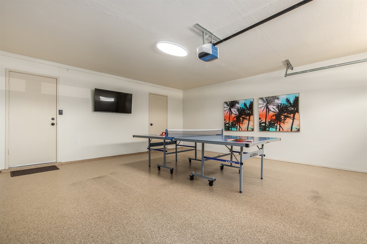 Garage has been set up as game room w/ smart TV & ping pong
