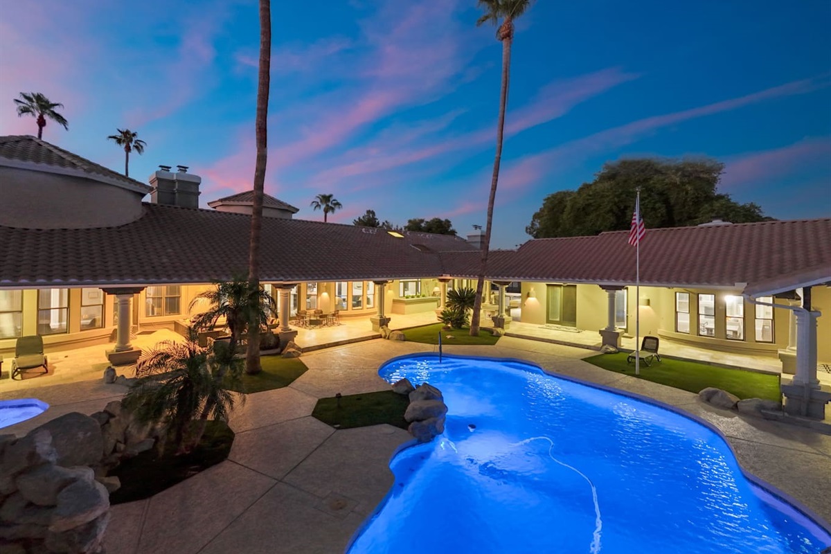 The peaceful ambiance of this beautifully lit pool invites evening dips and starry-sky lounging.

