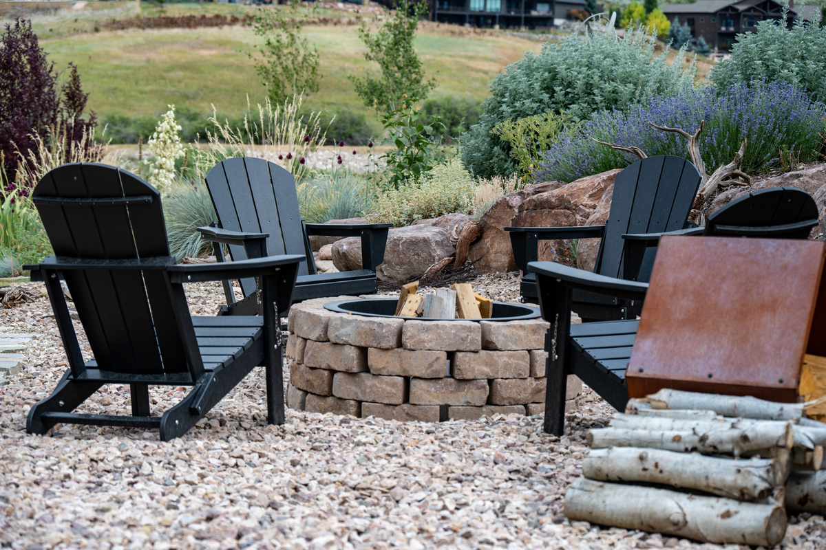 Roast s'mores with friends and family at the fire pit with Adirondack Chairs.
