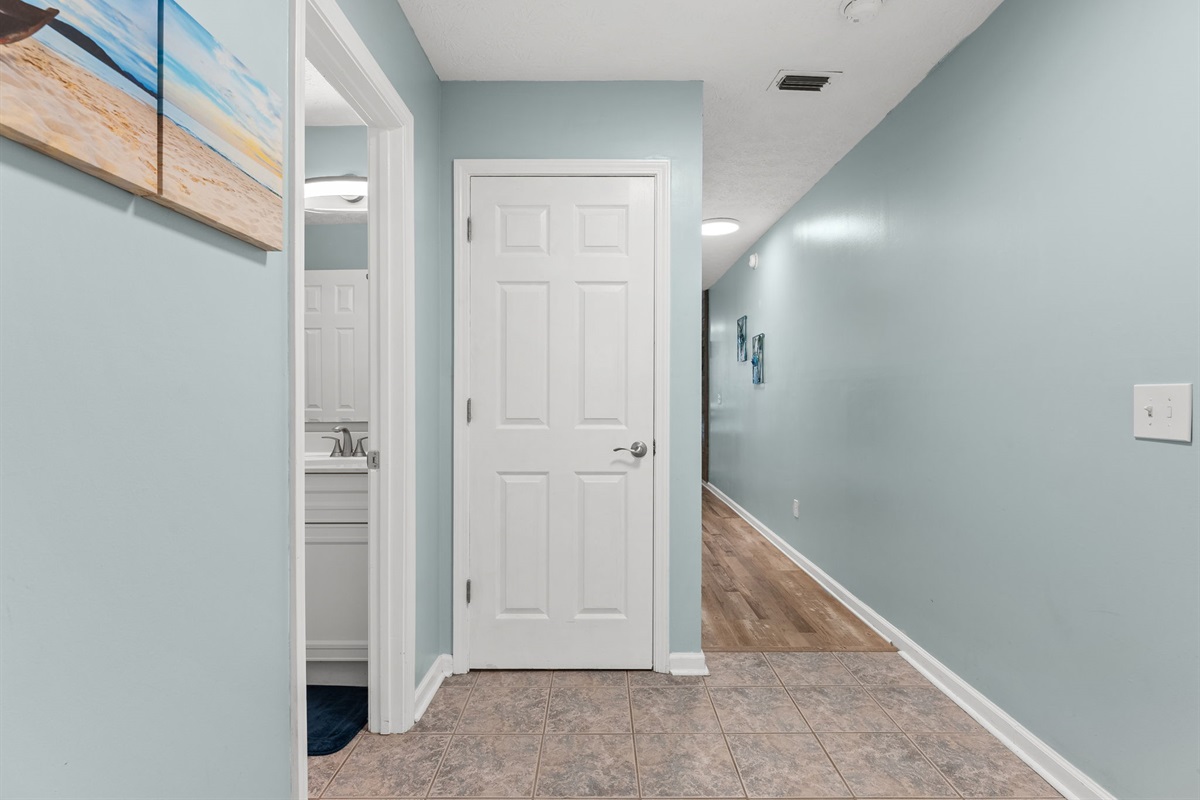 Laundry and hallway half bathroom doors, hallway to bunks and living room!