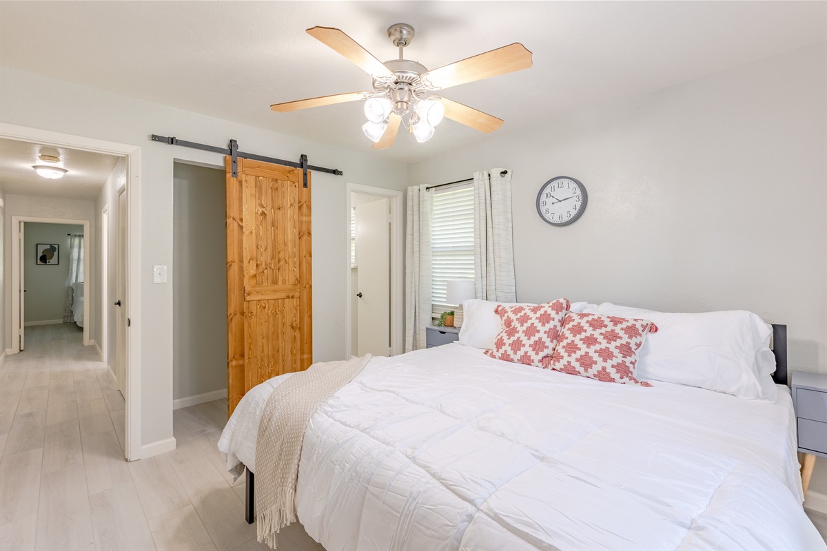Your getaway starts here: master suite featuring a cozy king bed.