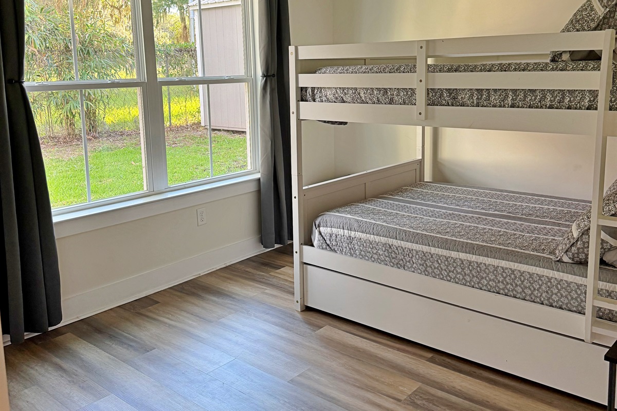Natural light fills the room with the large window or close the room darkening curtains for room darkness.