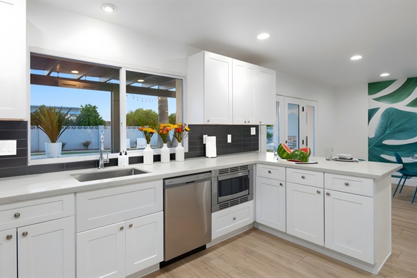 Stainless steel appliances and a view of the pool make the kitchen a pleasure