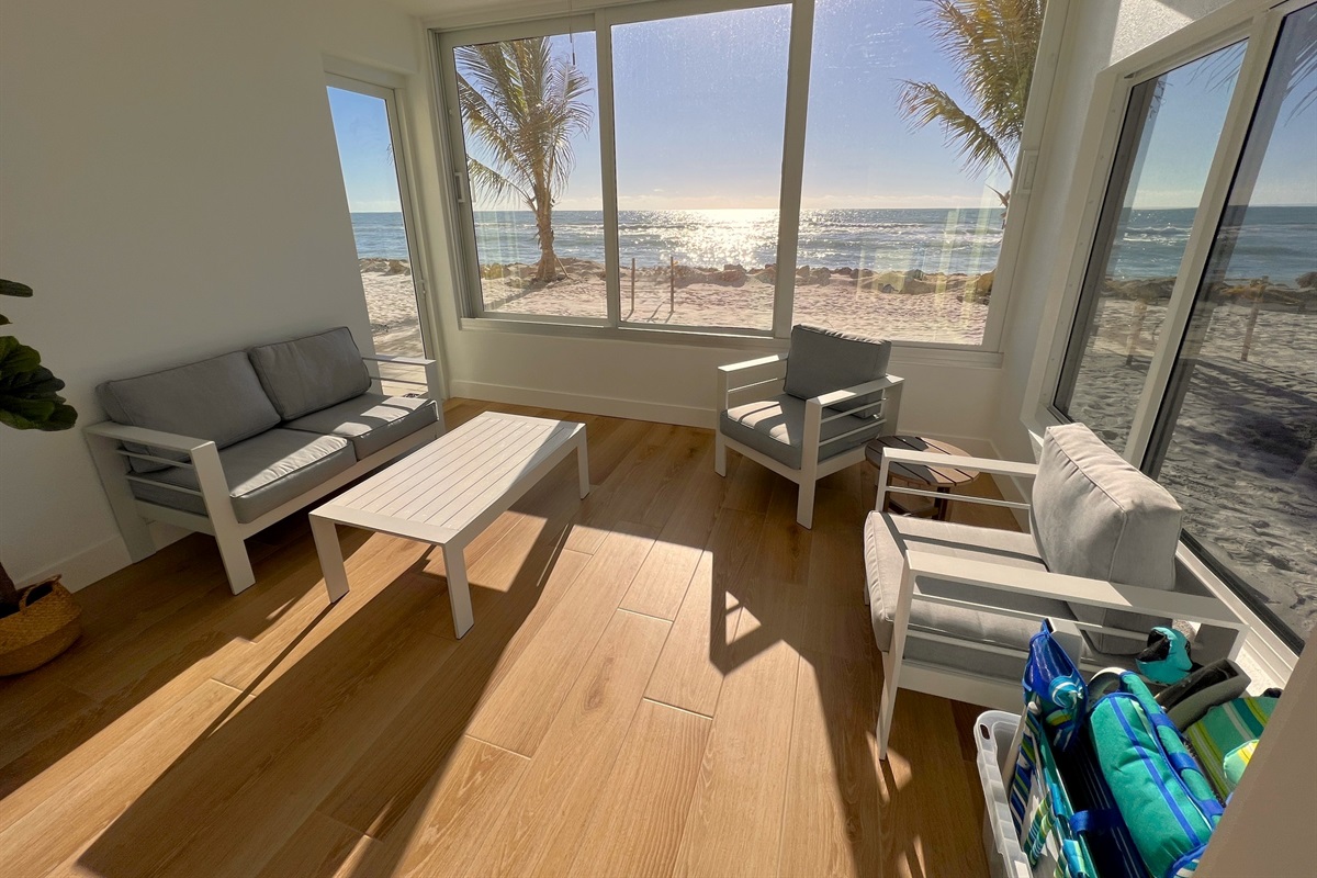 Unmatched lanai view of the beach and Gulf with door and sliding windows. 
