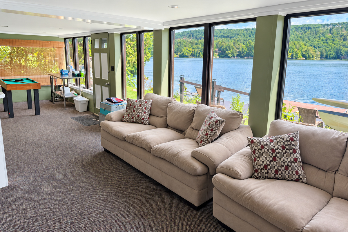 Peaceful lake views the full length of the lower level game room
