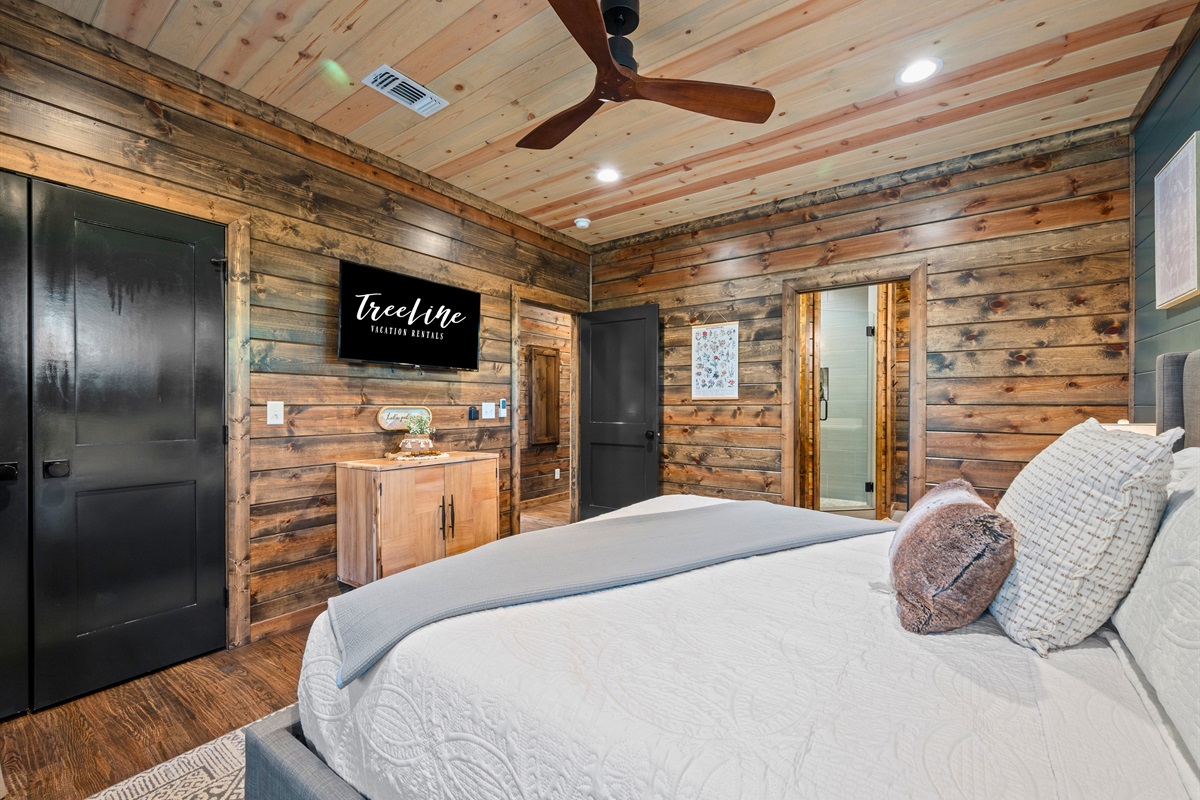 From this view, you can see how comfortable and inviting this bedroom is, making it a great spot to recharge after a full day of fun.