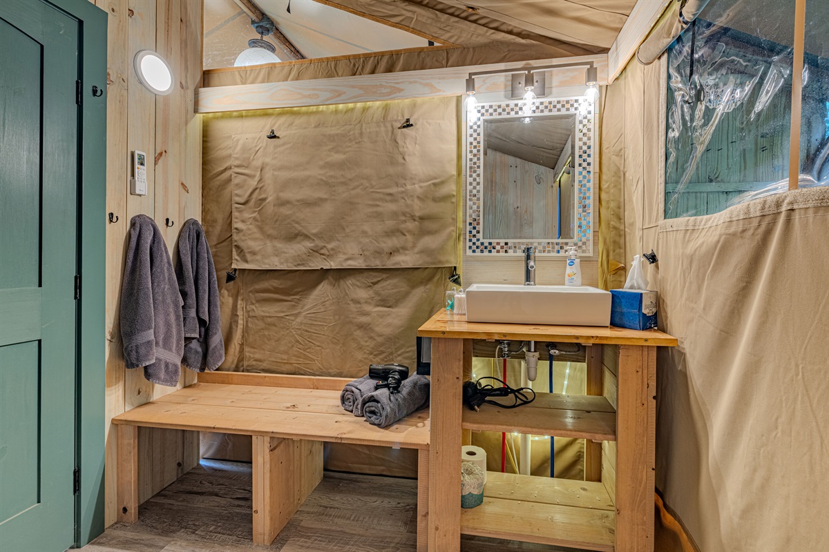 Every convenience, designed with style. From the rugged wooden accents to the stylish sink and mirror, we've created a luxurious interior where you can easily prepare for your day.