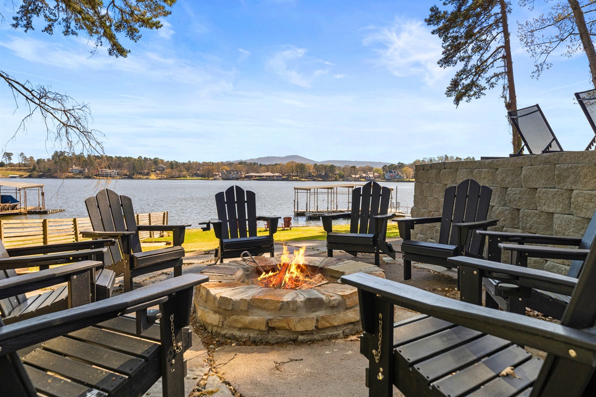 Settle in by the fire with comfortable seating all around, making it an ideal spot for sharing stories and enjoying the evening together.