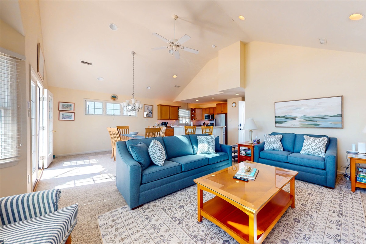 Spacious living room area with high ceillings