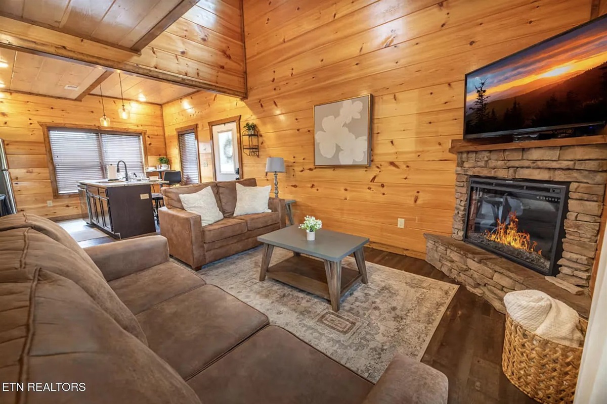 Kick back and relax in the cozy living room at Marigold Cabin, a premier 3-bedroom vacation rental in Pigeon Forge, TN. Comfortable seating, warm cabin d&eacute;cor, and a flat-screen TV make this the go-to spot for movie nights, game days, and unwinding after a 