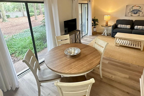Round dining table by the patio doors
