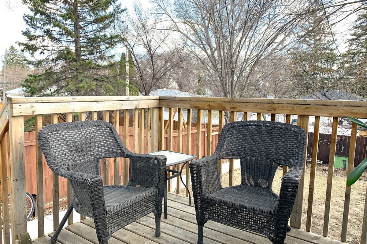 Two-seat deck setup for morning coffee or quiet evenings