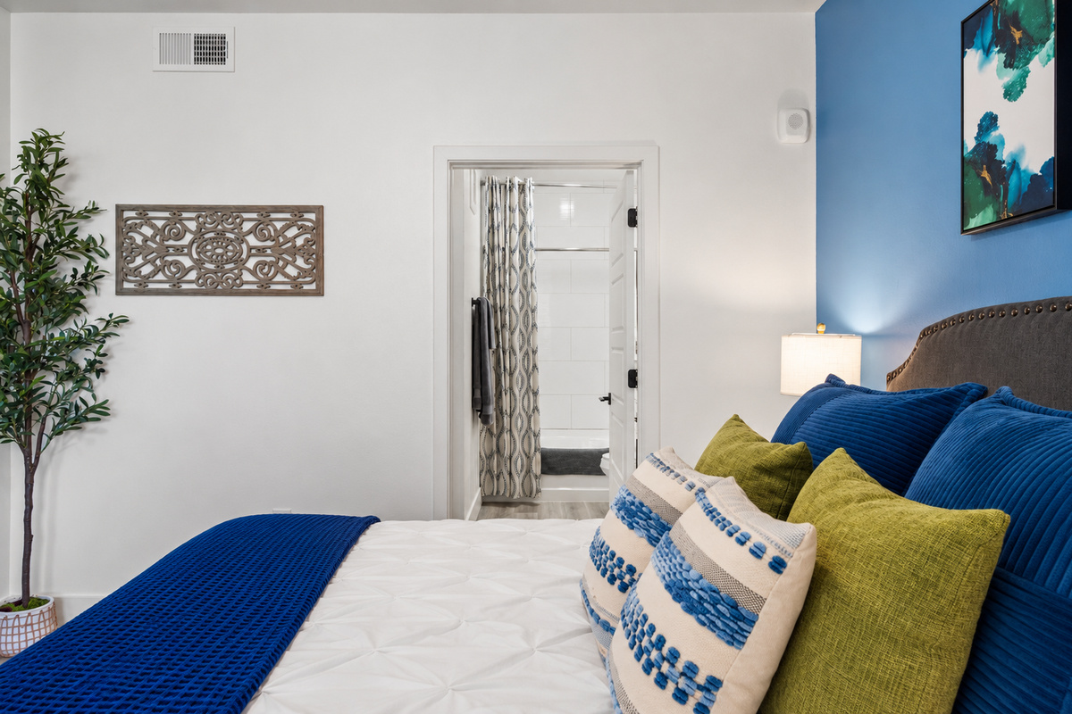 - Bedroom designed with soothing tones modern artwork and soft lighting   - Plush bedding and accent pillows add a cozy touch to your stay experience   - A comfortable peaceful hideaway offering restful nights and relaxing vibes
