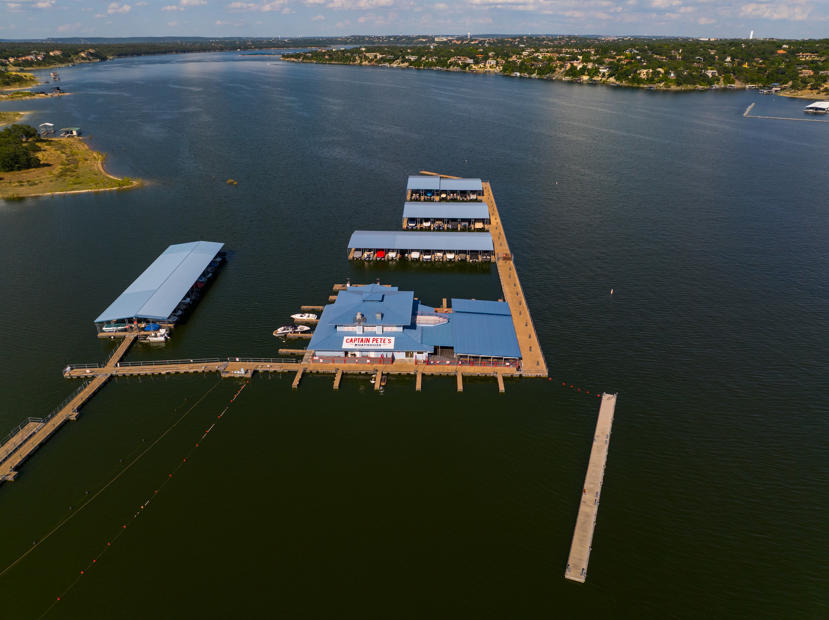 Floating restaurant and bar on Lake Travis with casual food, cold drinks, and live music on weekends.