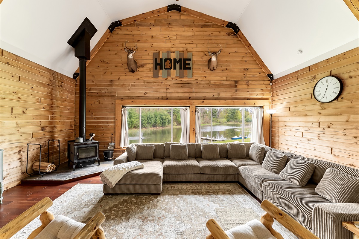 Living room with woodstove with view of the pond.
