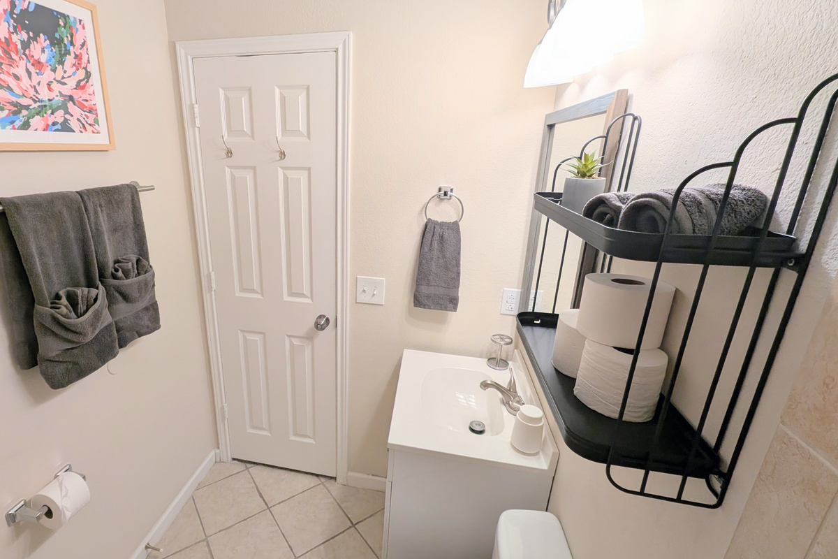 Full bath has foaming hand soap, hair dryer, extra toilet paper, and step stools. 