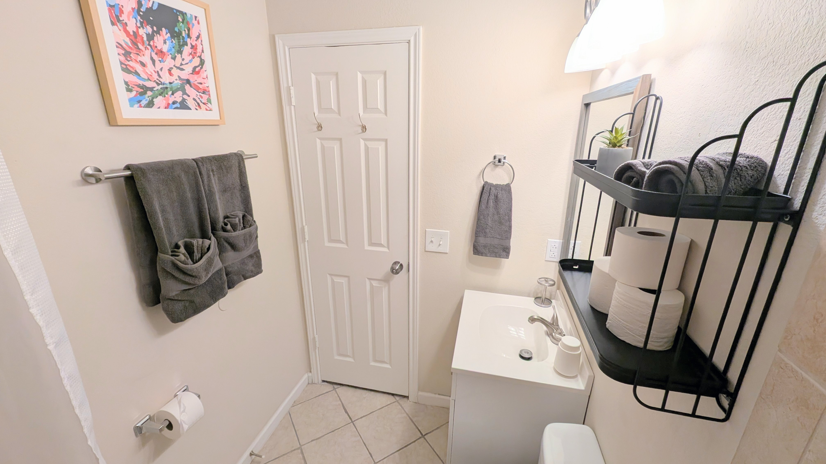 Full bath has foaming hand soap, hair dryer, extra toilet paper, and step stools. 