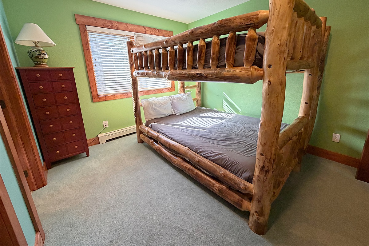 Bedroom #2 with Queen-over-Queen bunk beds and attached full bathroom on upper level.