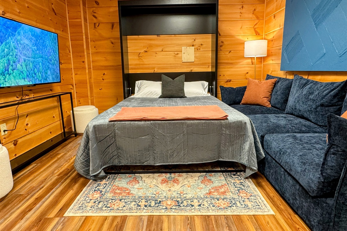 We understand that nobody likes to sleep on a pull-out sofa, so our guests can enjoy a high-quality mattress on this comfortable Murphy bed that transforms the gathering space into a third sleeping area.