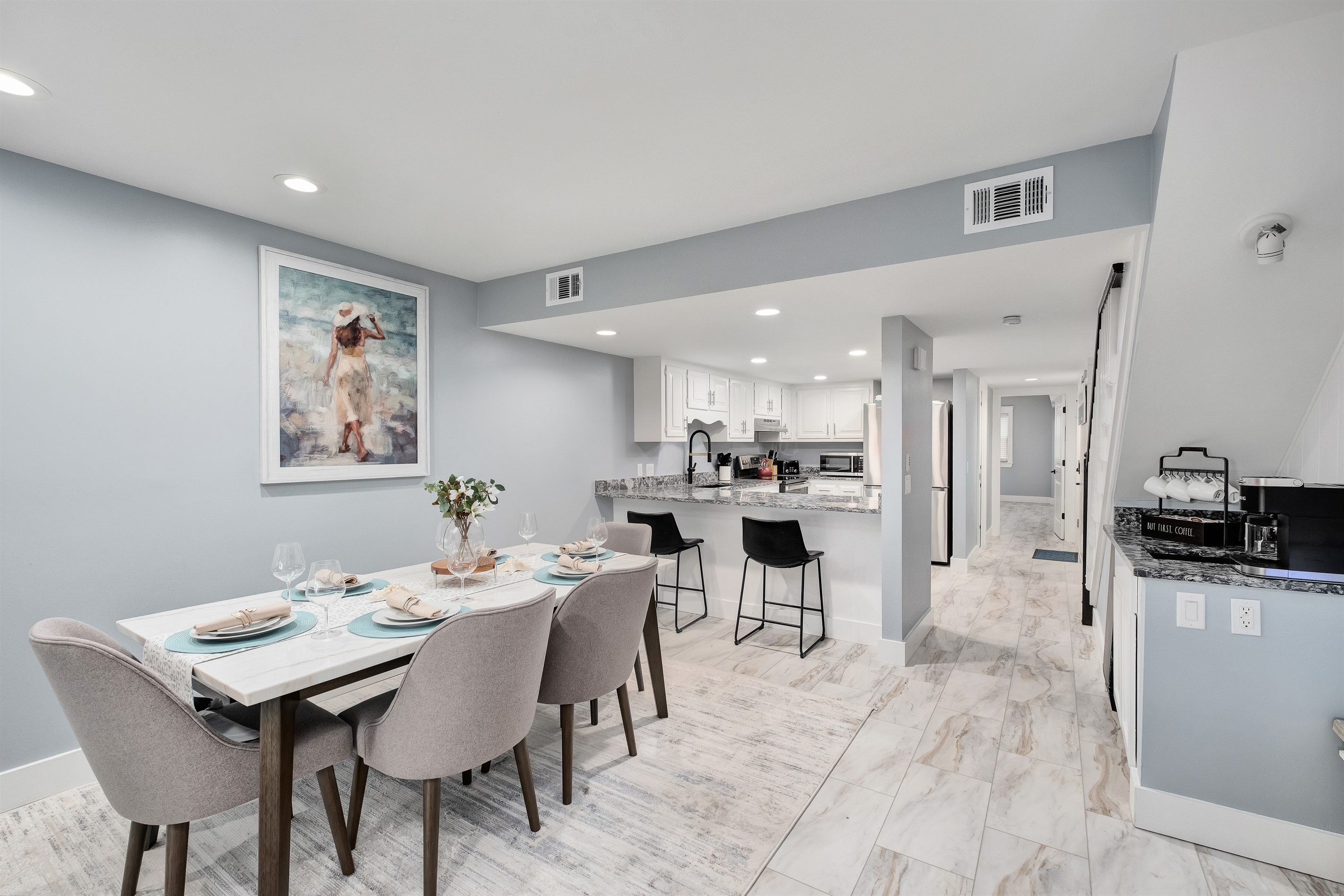 Enjoy family meals in the elegant dining area that seats 6 at the table and 2 at the bar. We also provide a high chair for the babies not pictured here.