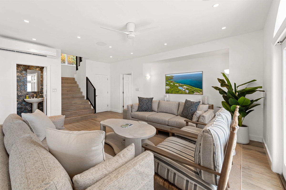 Spacious, ocean-view lounge with vaulted ceilings, Smart TV, board games, and room to unwind. Perfect for lazy mornings or movie nights.