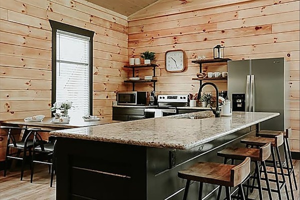 A bright, open kitchen-dining space perfect for cooking together and sharing meals that feel like home