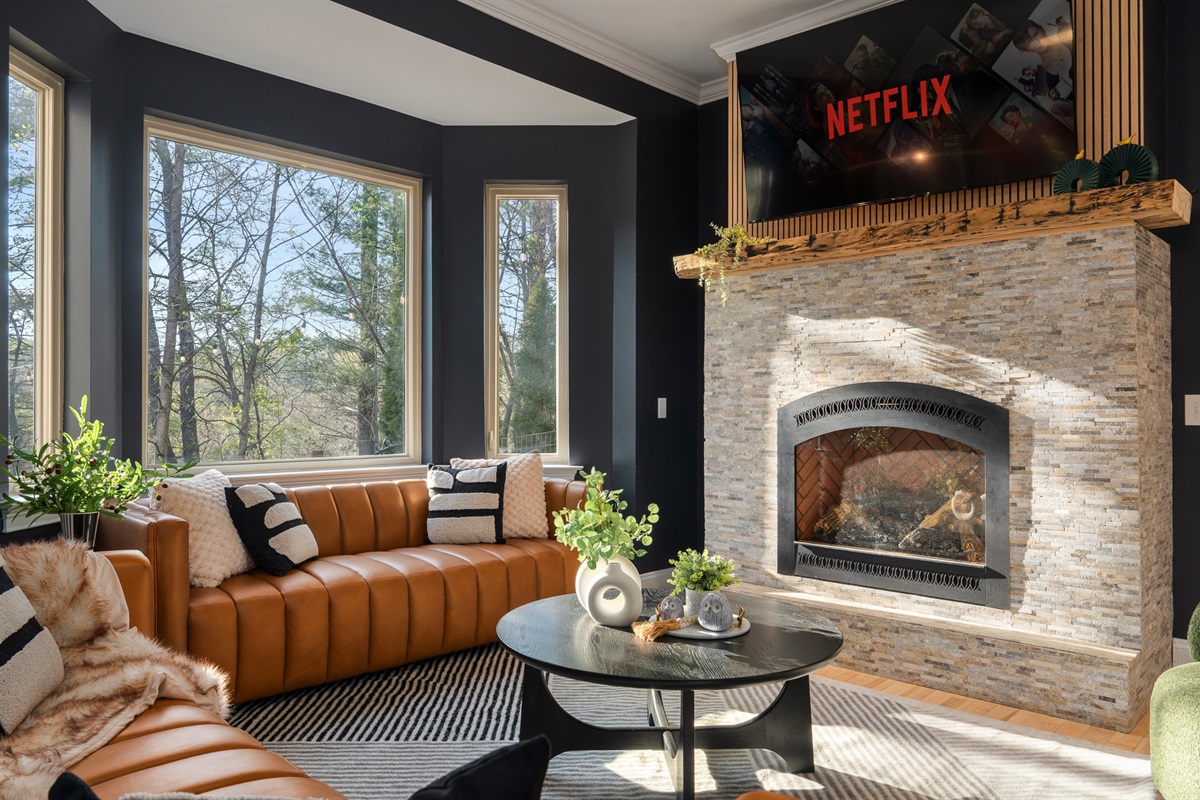 Bright, open living area with wooded views - feels private while still being minutes from Asheville