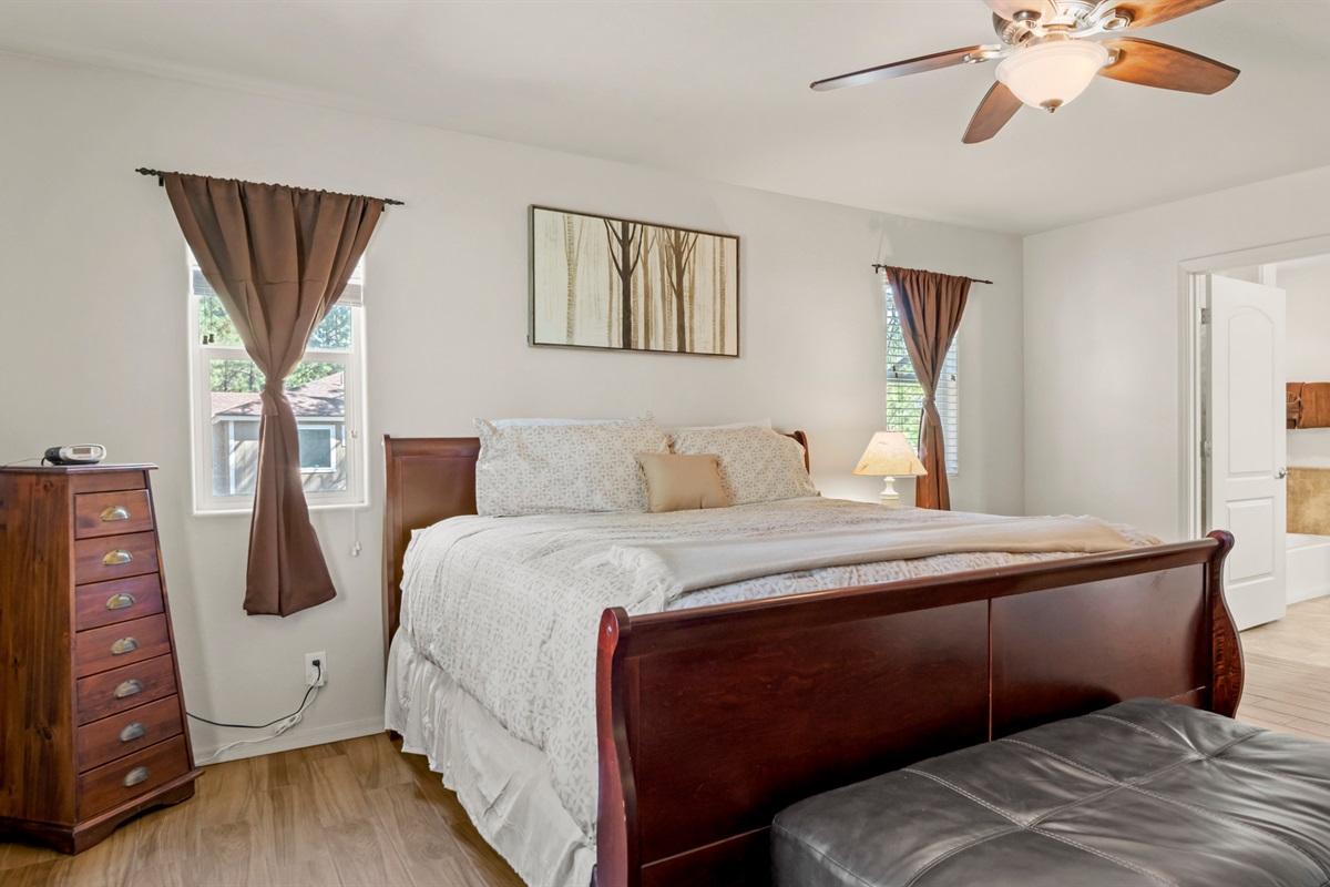 This serene master bedroom invites you to relax in the king bed.