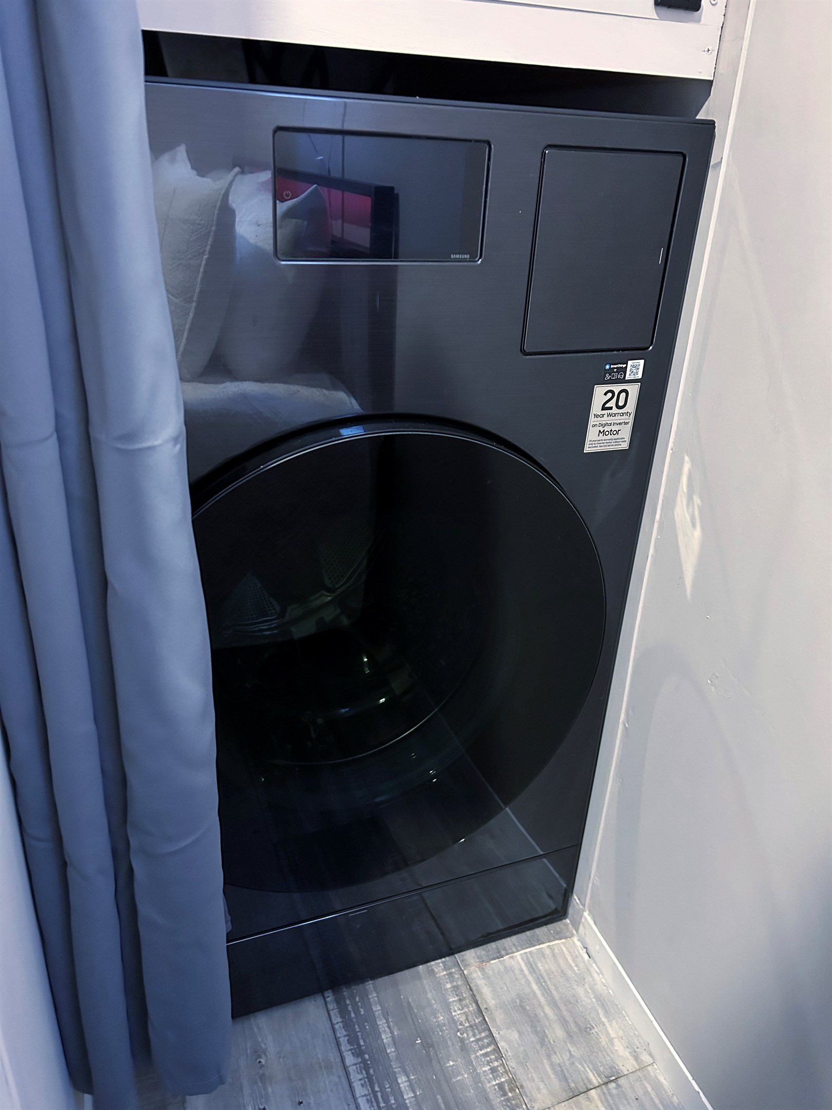 Washer/dryer combo hidden in bedroom 1 closet