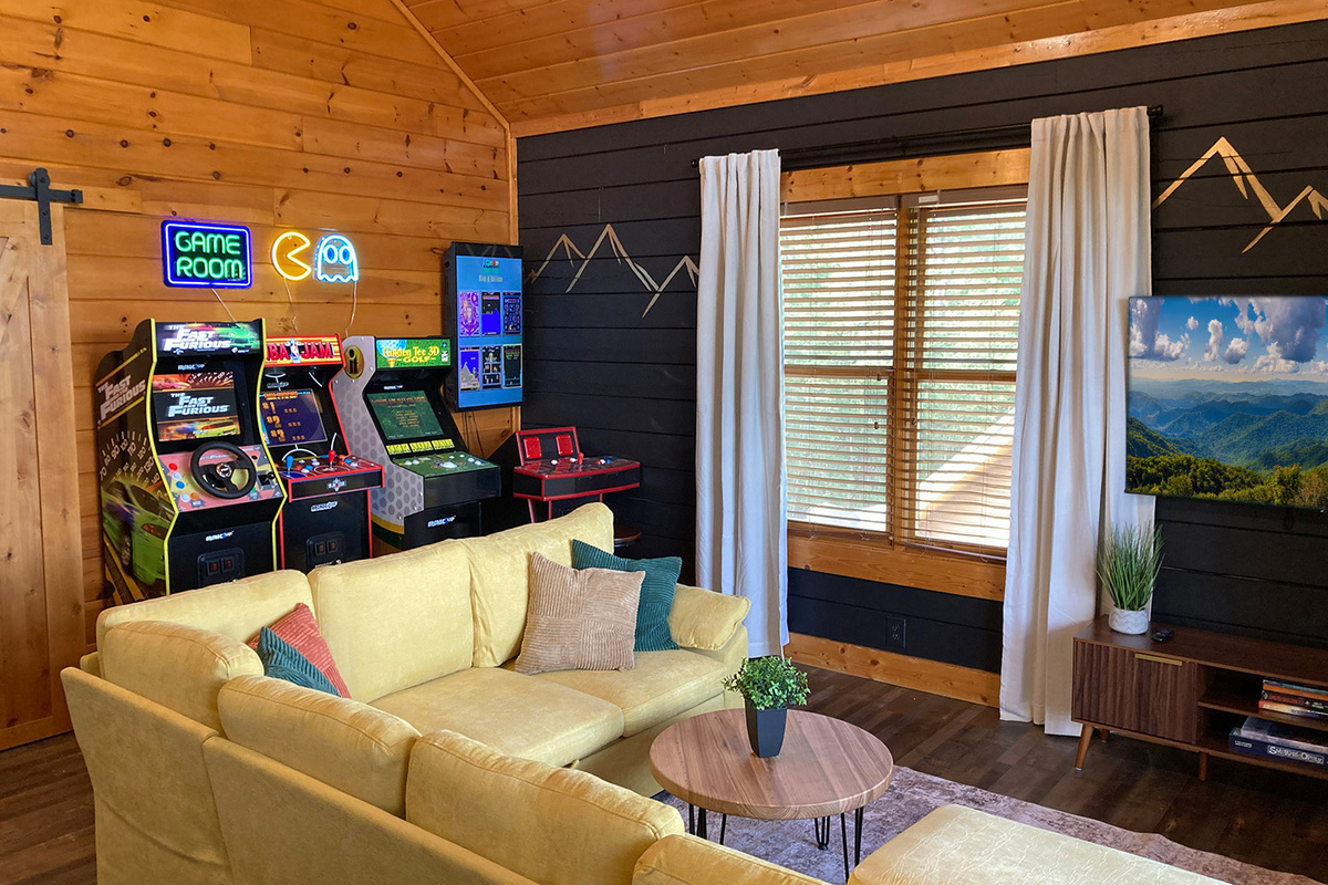 Newly updated game room with arcade games to suit everyone's interests and a large couch for enjoying your favorite streaming movies