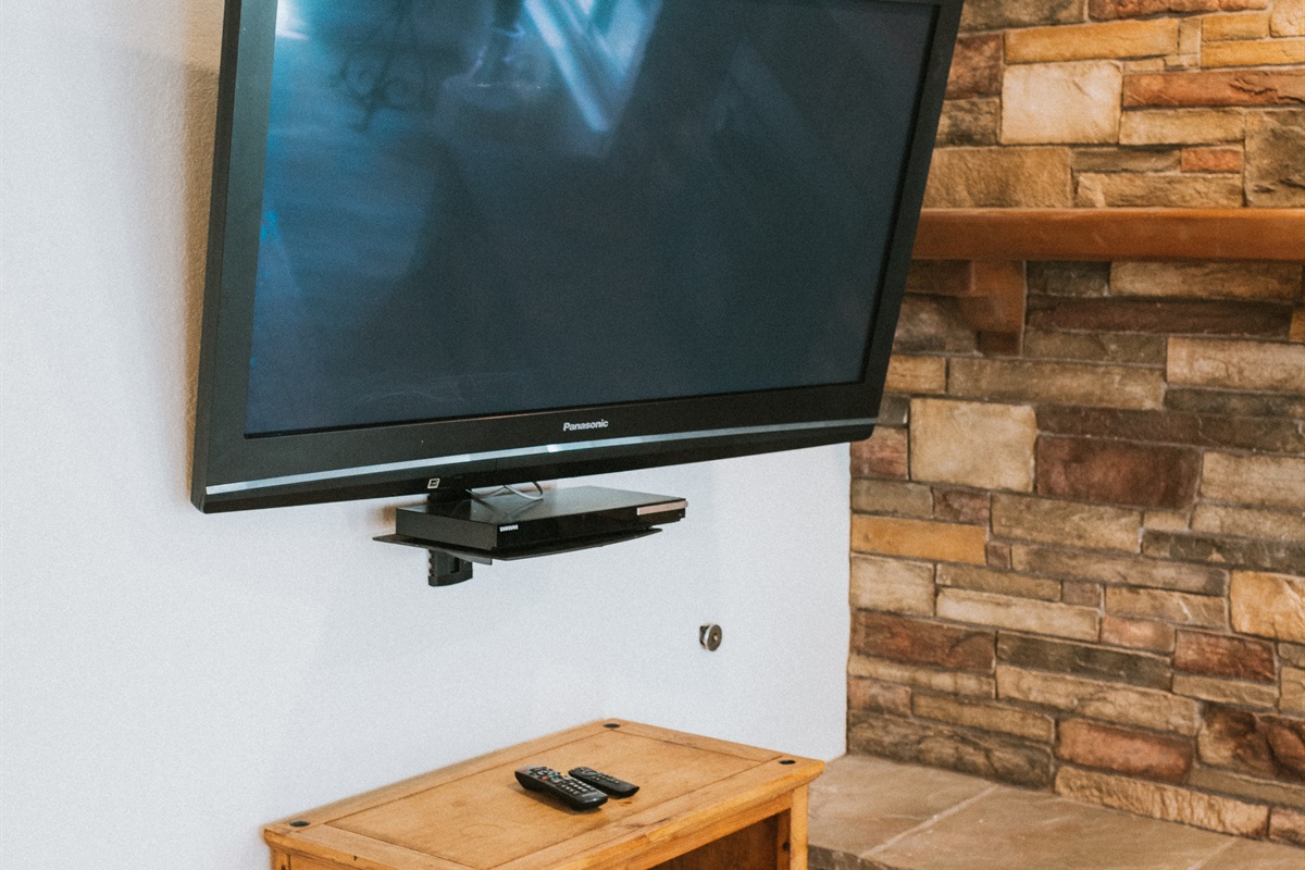 Enjoy a cinematic evening in this polished living space.