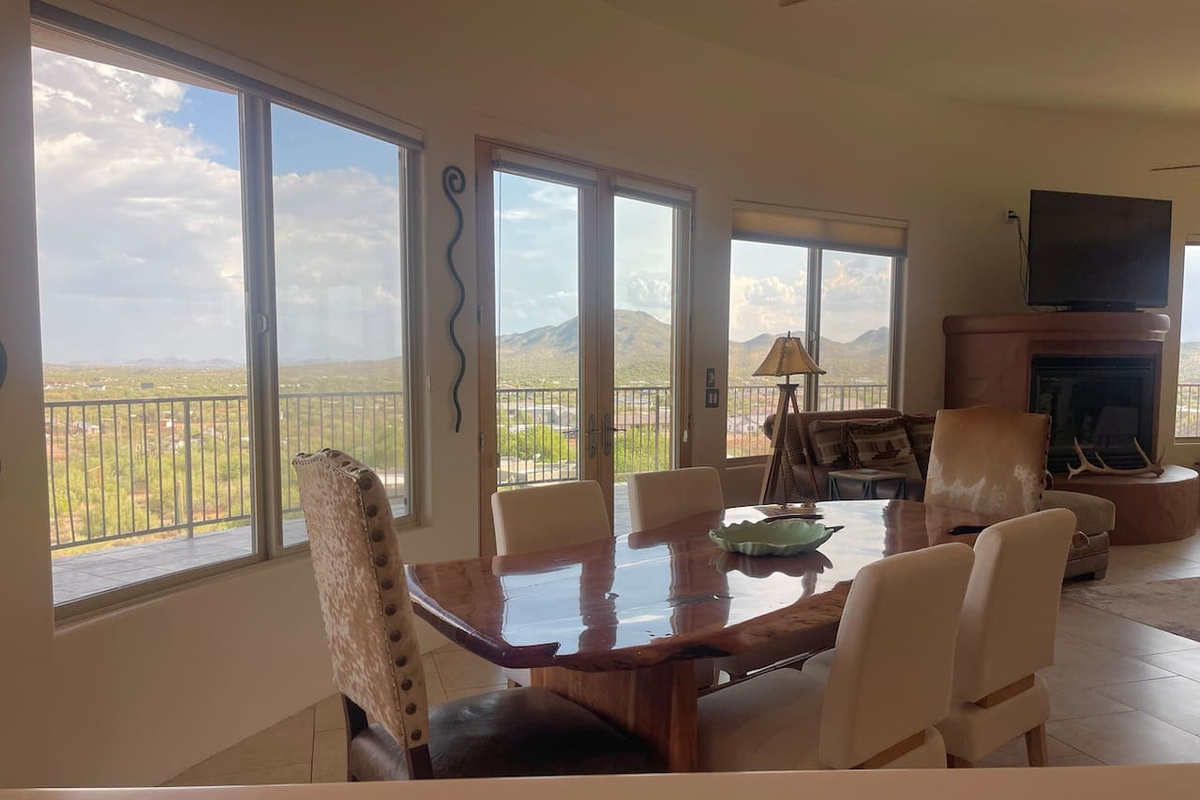 Window-lined dining area keeps the scenery in view while you sit down for a meal.